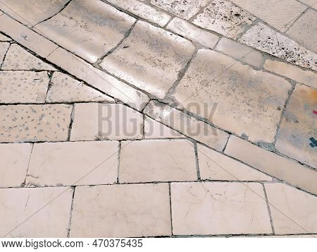 Marble Floor On The Street, Dubrovnik, Croatia. Antique Masonry Tiles Rectangular Blocks. Metamorphi