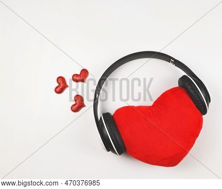Top View Or Flat Lay Of Red Heart Pillow Coverd With Headphones Isolated On White Background Decorat
