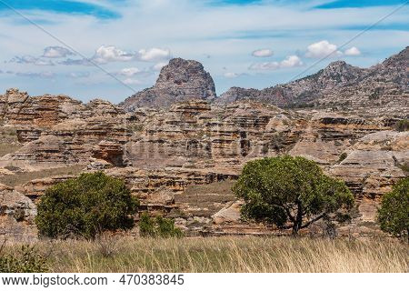 Isalo National Park In Ihorombe Region. Wilderness Landscape With Water Erosion Into Rocky Outcrops,