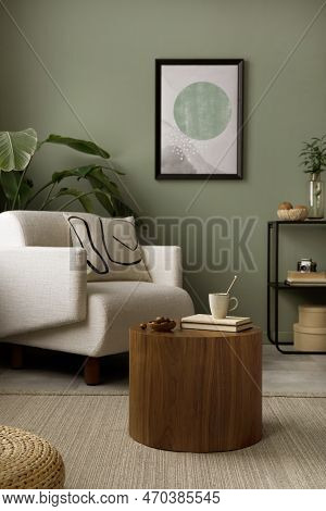 Stylish Composition Of Living Room Interior With Green Wall, White Armchair With Beige Pillow, Woode