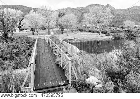 Kromrivier, South Africa - Sep 5, 2022: Pedestrian Bridge Over The Krom River At Kromrivier Cederber