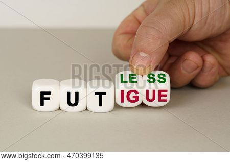 On A Gray Surface Are White Cubes With The Inscription - Fatless To Fatigue. Two Dice In Hand. Medic