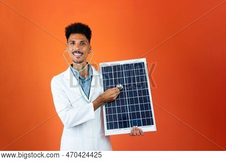Doctor Or Veterinarian Isolated On Orange Background. Black Young Doctor Medical Resident With Steth