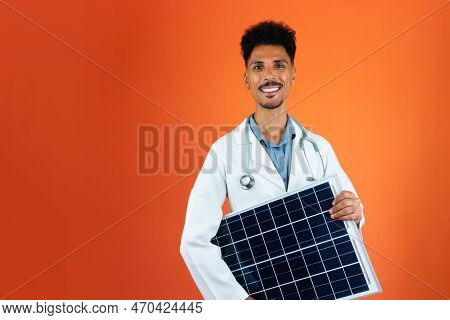 Doctor Or Veterinarian Isolated On Orange Background. Black Young Doctor Medical Resident With Steth