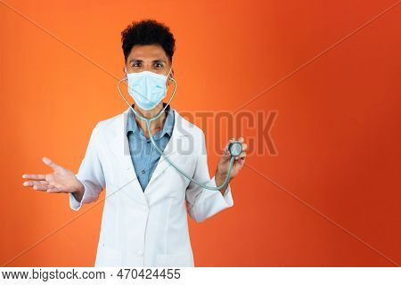Doctor Or Veterinarian Isolated. Black Young Doctor Medical Resident With Stethoscope And Pandemic M