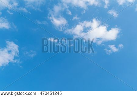Background Of Winter Blue Sky With White Clouds. Beauty Clouds In Sunshine Floating In The Sky High.