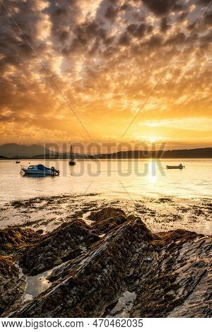 Sunrise At Borth-y-gest, Wales With The Snowdonia Mountains In The Background.