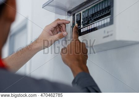 The Technician Checks The Electrical Control Cabinet In The House To Check Before Delivering The Hou