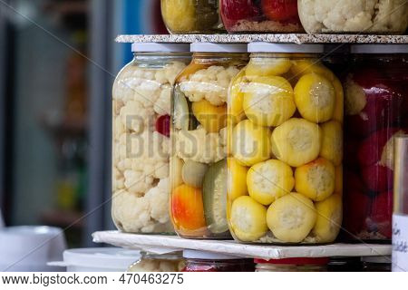 Selective Blur On Glass Jars Of Home Canning, Pickled Vegetables, On A Market In Romania, Mainly Can