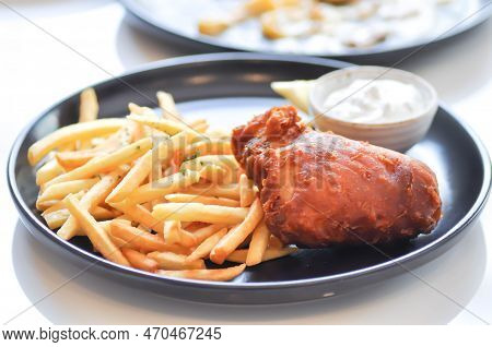 Fish And Chips Or Fried Fish And French Fries For Sere