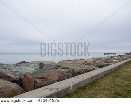 Resort In Winter. The Rocky Shore Is Washed By The Waves In Cloudy Weather. Black Sea Coast. The Coa