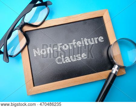 Glasses And Magnifying Glass With The Word Non-forfeiture Clause On A Blue Background.