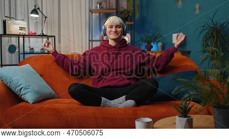 Keep Calm Down, Relax. Woman With Short Hair At Home Couch Breathes Deeply With Mudra Gesture, Eyes 