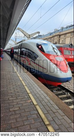 St. Petersburg, Russia - November 21, 2022: Moscow Station. People On Platform Go To Board Sapsan Hi