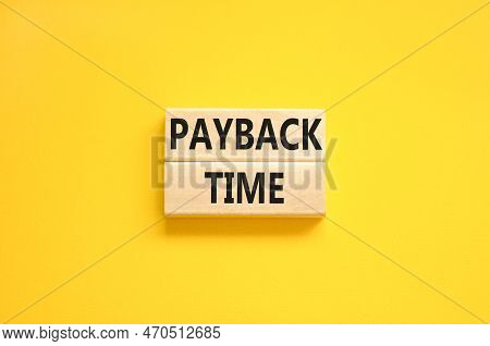 Payback Time Symbol. Concept Words Payback Time On Wooden Blocks. Beautiful Yellow Table Yellow Back