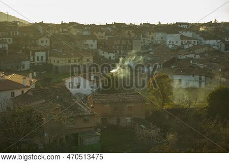 View At Sunset With Smoking Chimneys Of The Jewish Neighborhood Of Hervas In Caceres Horizontal