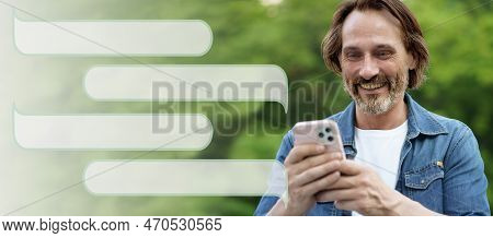 Social Media And Relationships Concept. Matured Smiling Man 45s With Phone In Hands Texting Sms In P
