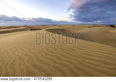 Maspalomas Dunes Before The Sunset. Landscape Photo Of Beautiful Desert And Ocean.