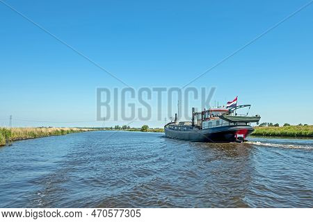Freighter On The Frisian Canals In Friesland The Netherlands