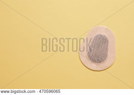 Contraceptive Patch On Yellow Background, Top View. Space For Text