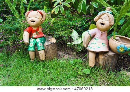 Ceramic dolls in the garden