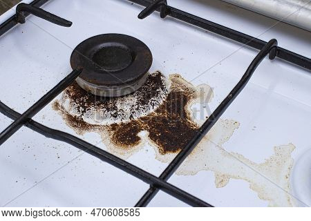 Dirty Gas Stove With Spilled Coffee From Cezve, Front And Background Blurred With Bokeh Effect