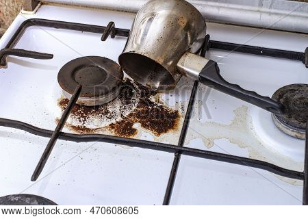 Dirty Gas Stove With Spilled Coffee From Cezve, Front And Background Blurred With Bokeh Effect