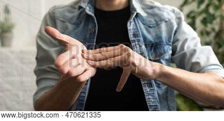 Sign Language Interpreter Man Translating A Meeting To Asl, American Sign Language. Empty Copy Space