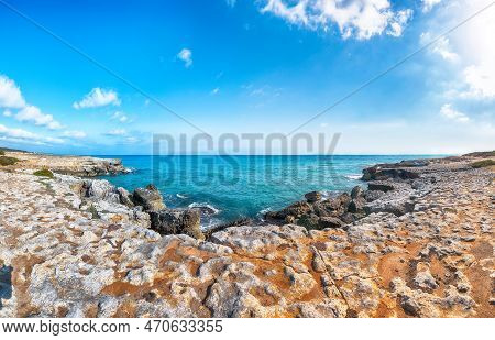 Picturesque Seascape With Rocky Cliffs, Sea Bay, Islets And Faraglioni Near By Conca Specchiulla Bea
