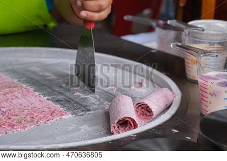Woman Cooking Thailand Stir-fried Ice Cream Rolls At Freeze Pan. Organic, Natural Rolled Ice Cream, 