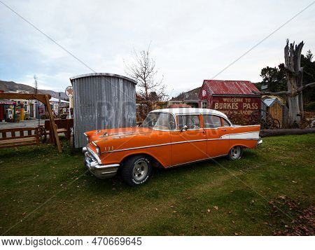 Burkes Pass, New Zealand - 2023: Old Historic Vintage Retro Orange Classic Car In Burkes Pass Villag