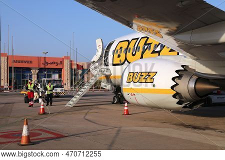 Agadir, Morocco - February 13, 2022: Workers Handle Boeing 737 Max Of Ryanair Buzz Airline At Agadir