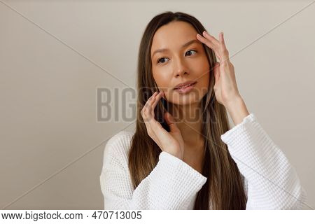 Young Multiracial Woman Doing Face Building Yoga And Facial Gymnastics Self Massage And Rejuvenating