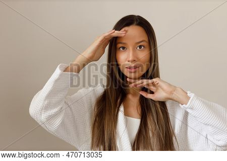 Young Multiracial Woman Doing Face Building Yoga And Facial Gymnastics Self Massage And Rejuvenating