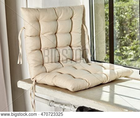 Cozy Window Seat With Soft Beige Fabric Cushion