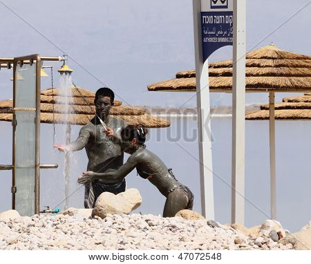 Young Caucasian  Couple Taking Mud Treatment