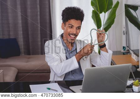 Brazilian Black Doctor Or Veterinarian Working At Home. Young Man Doing Home Office During The Day A