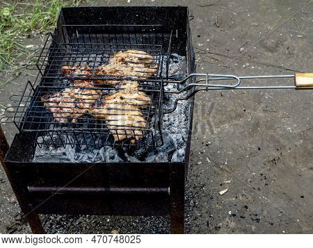 Meat Is Cooked On The Grill On The Grill In The Summer