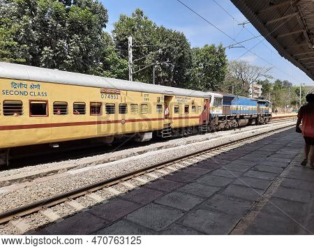 Closeup Of Beautiful Mandya Railway Station And Electric Train Moving On A Track.
