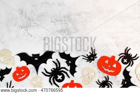 Minimalsitic Halloween Background With Skulls,pumpkins,bats Abd Spiders On White Concrete Background
