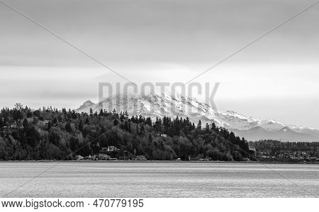 Clouds Cover Mount Rainier Across The Puget Soud In Washington State.