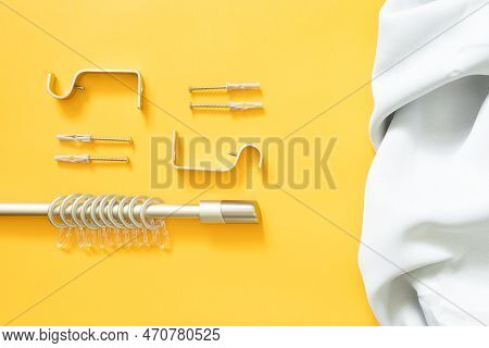 Curtain Rod With Fasteners, Rings And Hooks For Hanging Curtains On A Yellow Background And Curtain 