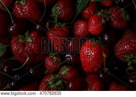 Strawberries And Cherries On The Table. Top View.