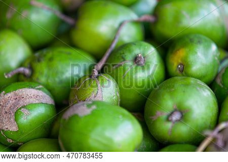 Close-up On A Stack Of Ambarellas (jew Plums) For Sale On A Market Stall.