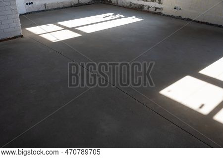 The Leveled Rough Floor In A House Under Construction With A Semi-dry Cement Screed Is A Smooth Surf