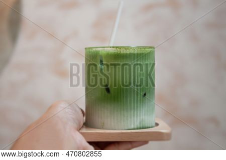 Hand Holding Iced Matcha Greentea, Stock Photo