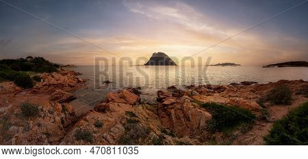 Rocky Beach On The Mediterranean Sea. Punta Don Diego, Sardinia, Italy. Dramatic Sunrise Sky Art Ren