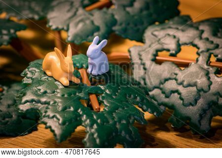 Toy Rabbits Standing In A Green Leaf