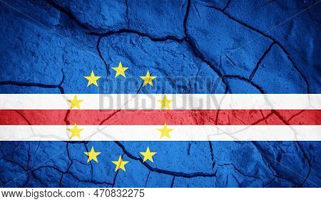 Flag Of Republic Of Cabo Verde. Cabo Verde Symbol. Flag On The Background Of Dry Cracked Earth. Cape