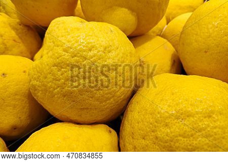 Close-up On A Stack Of Citron (citrus Medica) On A Market Stall.